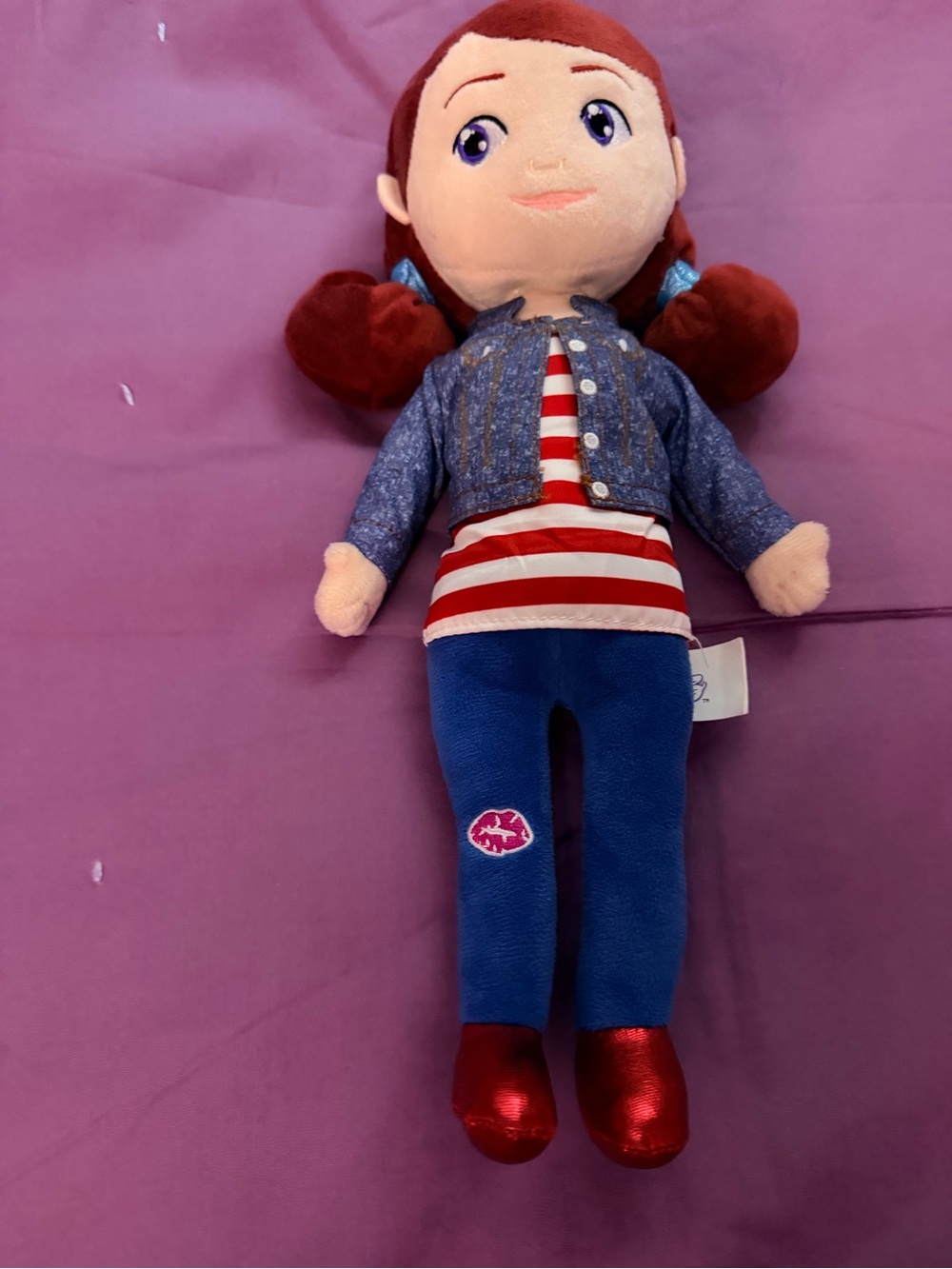 Glitter Baddiez soft plush diverse doll with red pigtails and a striped shirt